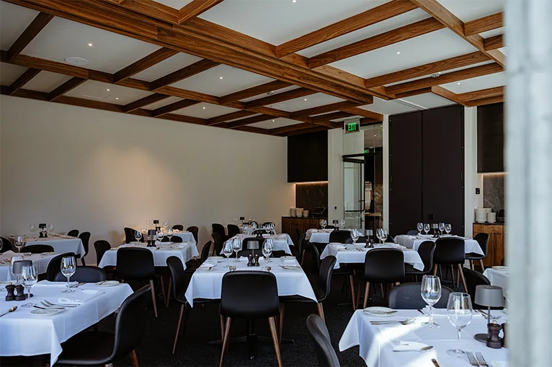 Many set tables in the Continental Divide private dining room Many set tables in the Continental Divide private dining room.
